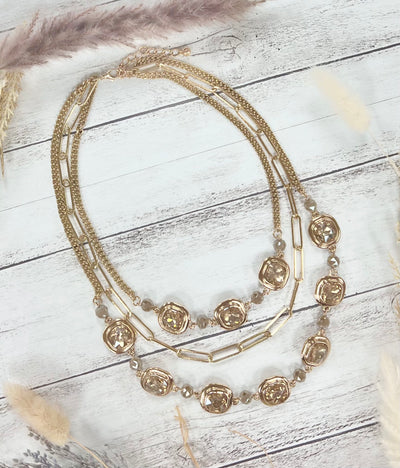 Gleaming Gold Symphony: Chunky Layers & Crystal Sparks Necklace