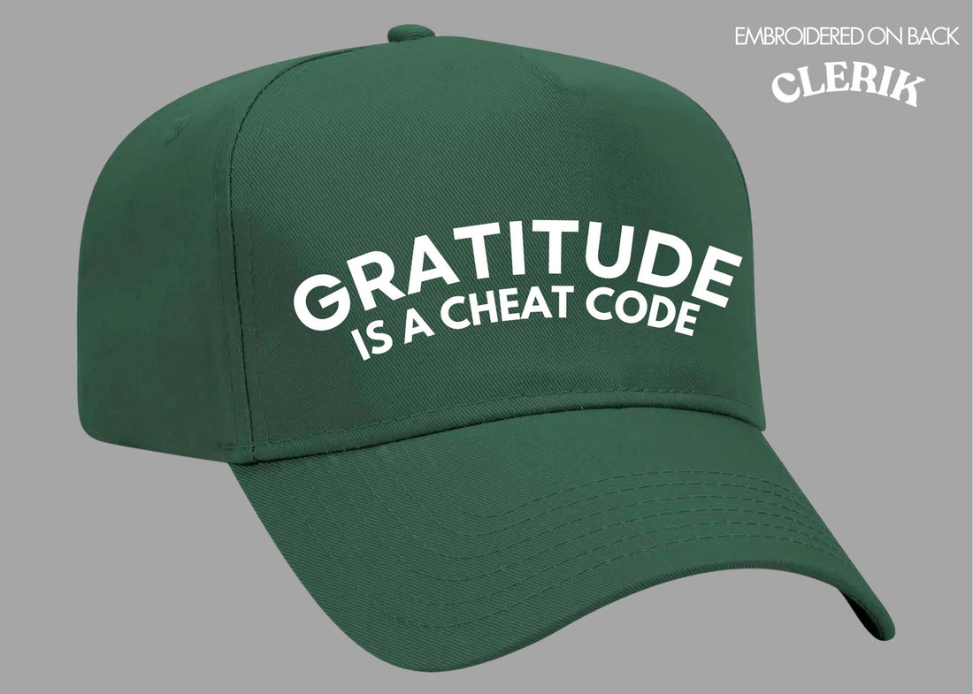 "Gratitude is a Cheat Code" on Green Cap